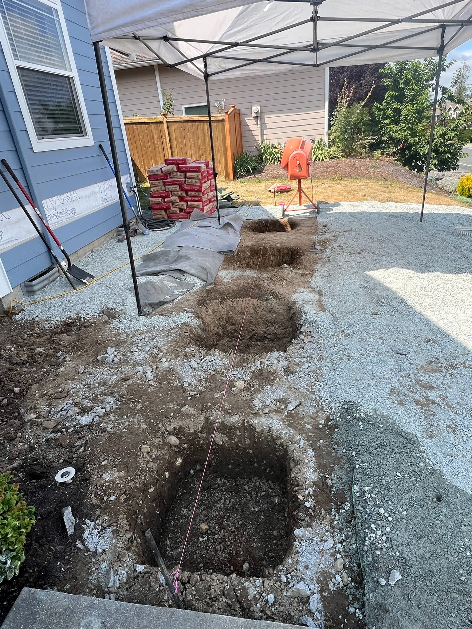 Pier locations excavated for the new deck foundation