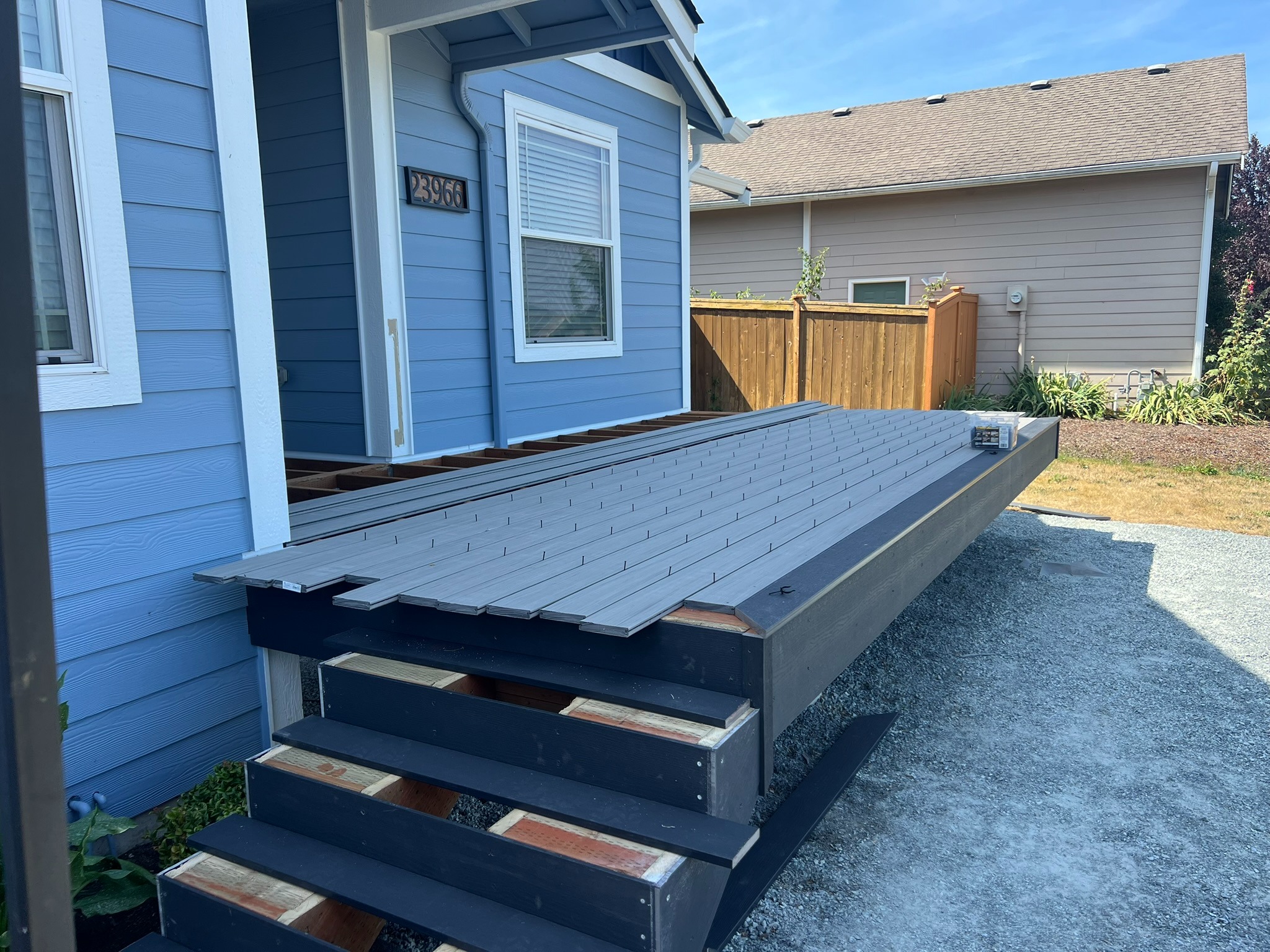 Decking and entry stairs installed before final railing work