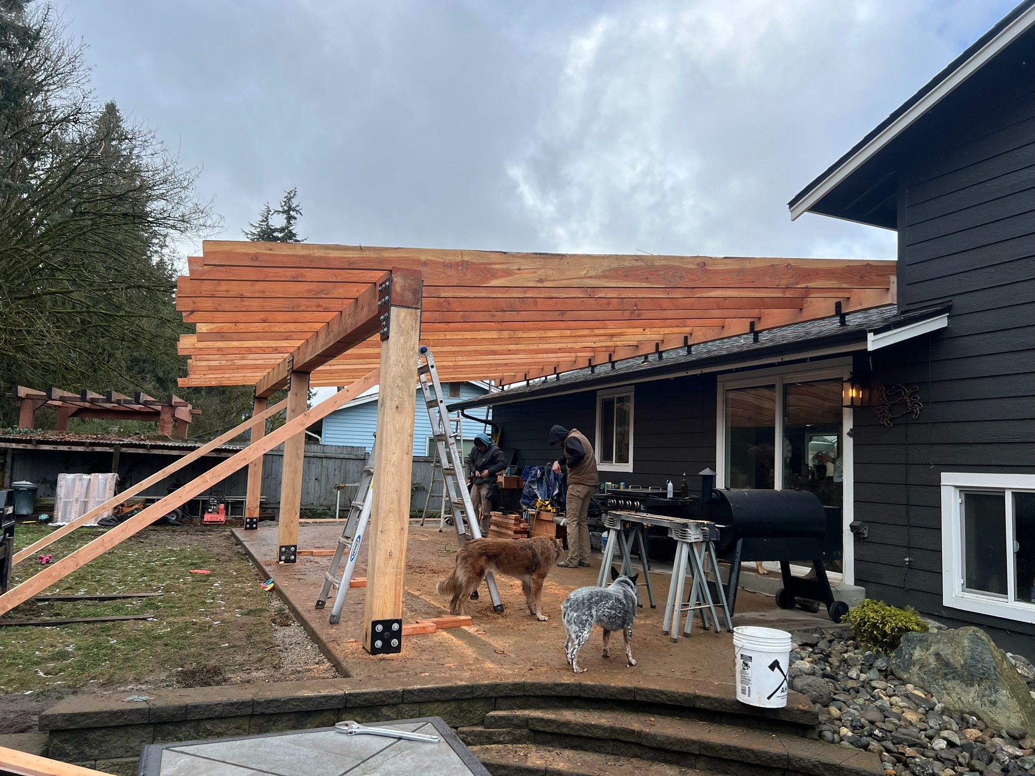Wood rafters installed across the new patio cover