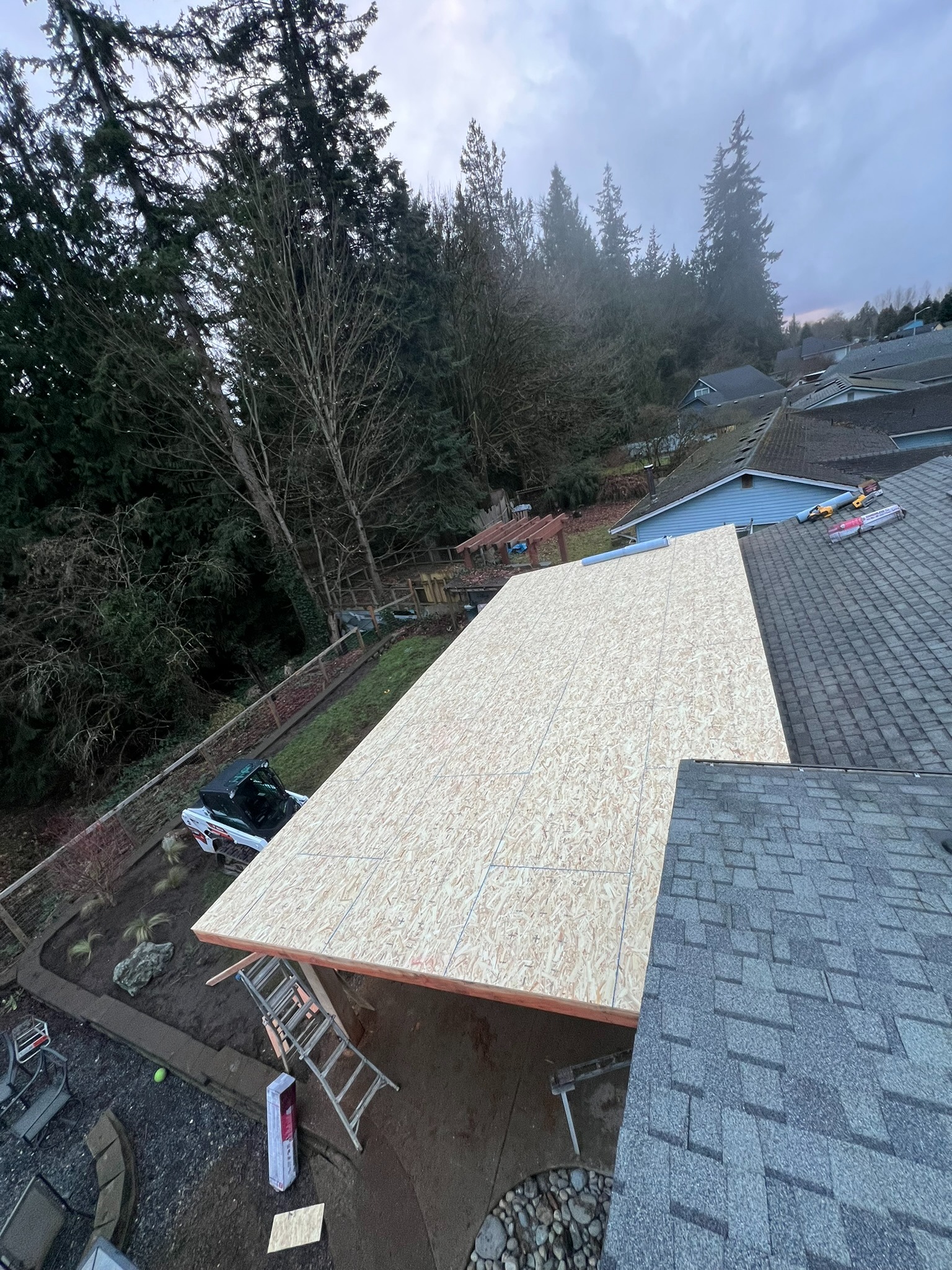 Roof sheathing installed over the patio cover framing