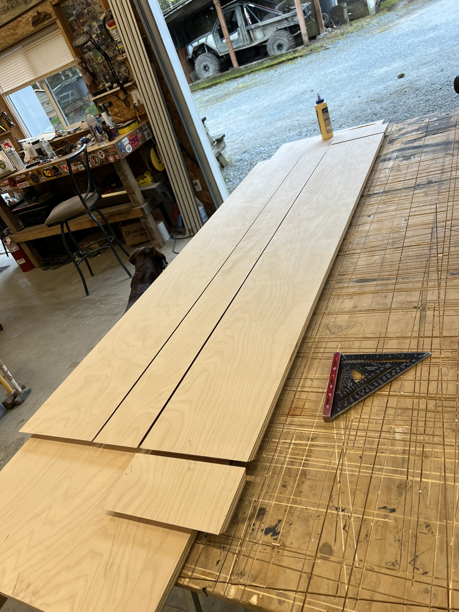 Wood panels being fitted and assembled for the custom floating shelf